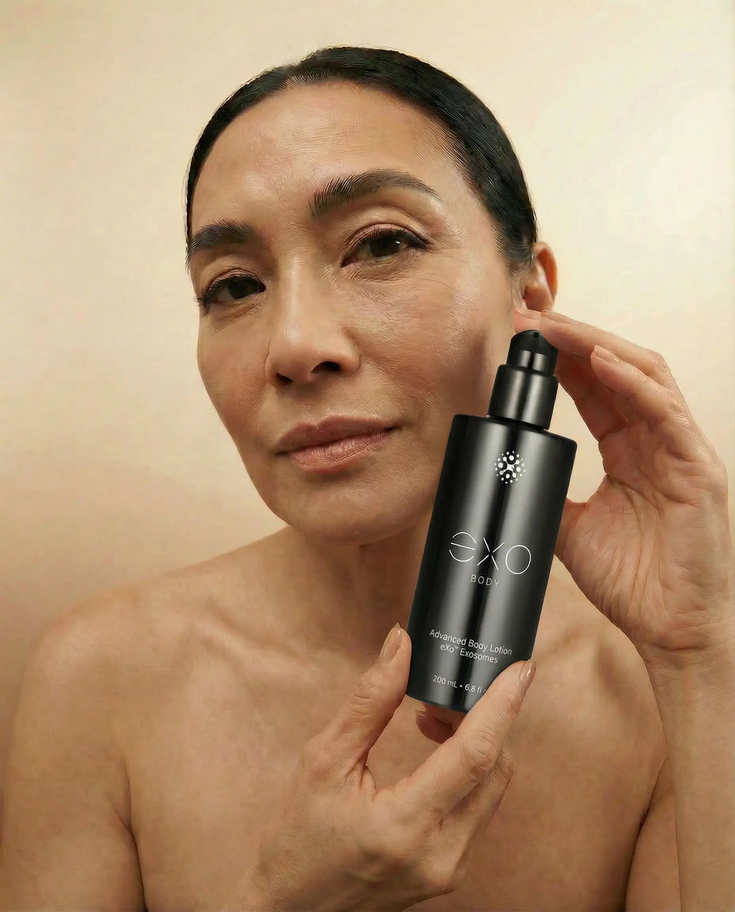 Asian female holding the bottle