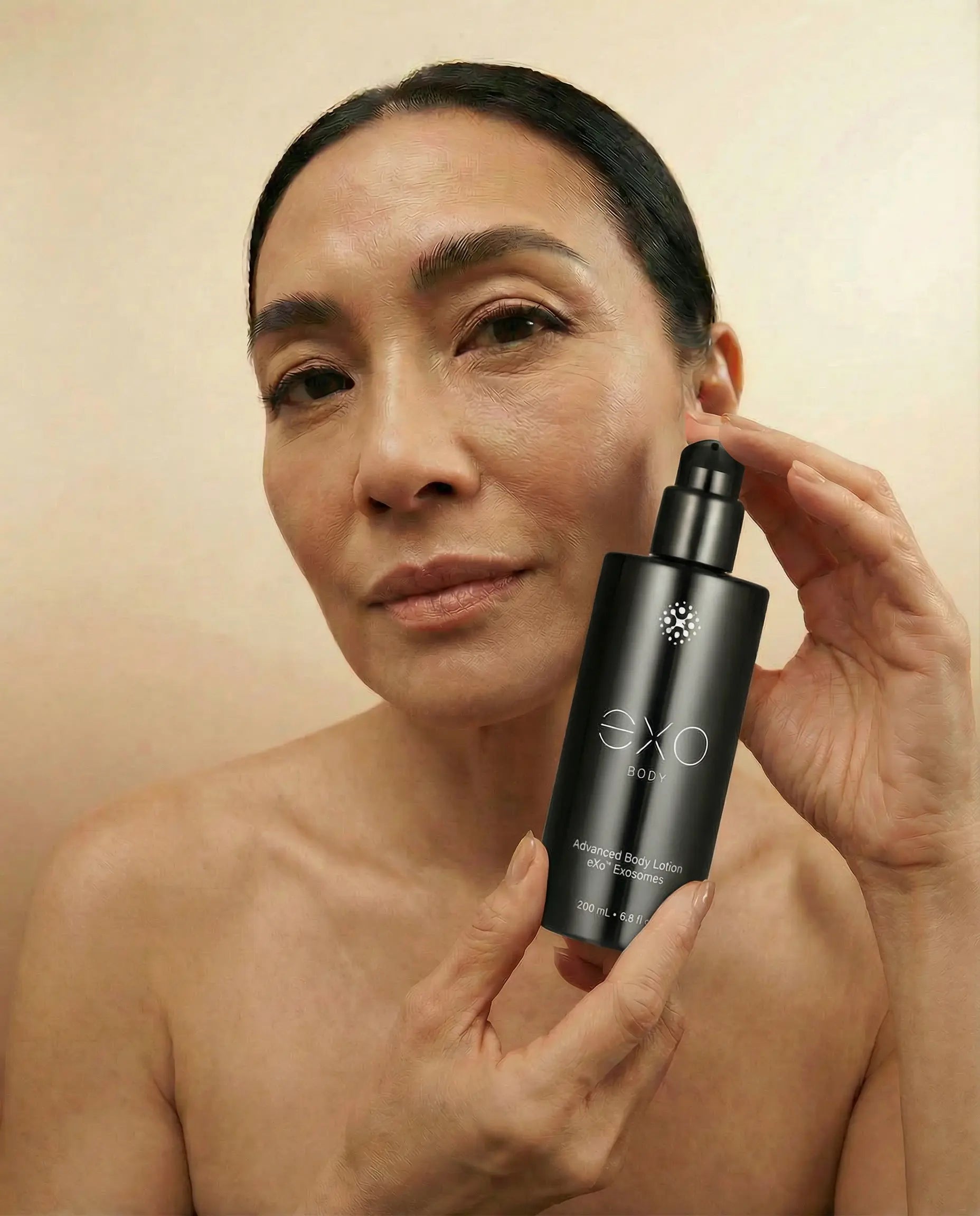 Asian female holding the bottle