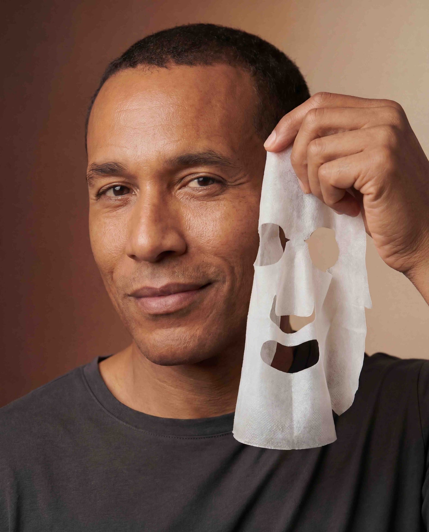 Man holding Revision BioCellulose Mask