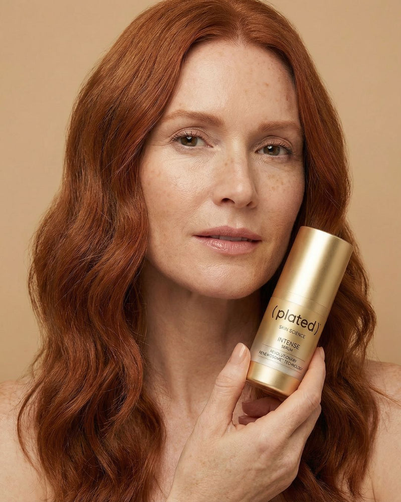 Woman holding botttle of Plated Intense Serum