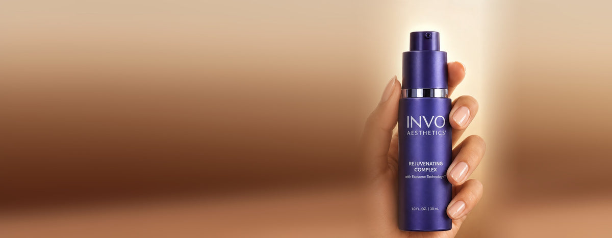 INVO Rejuvenating Complex exosome serum, 30 mL, held in hand — the exosome serum Dr. Piazza stocks at The Piazza Center in Austin